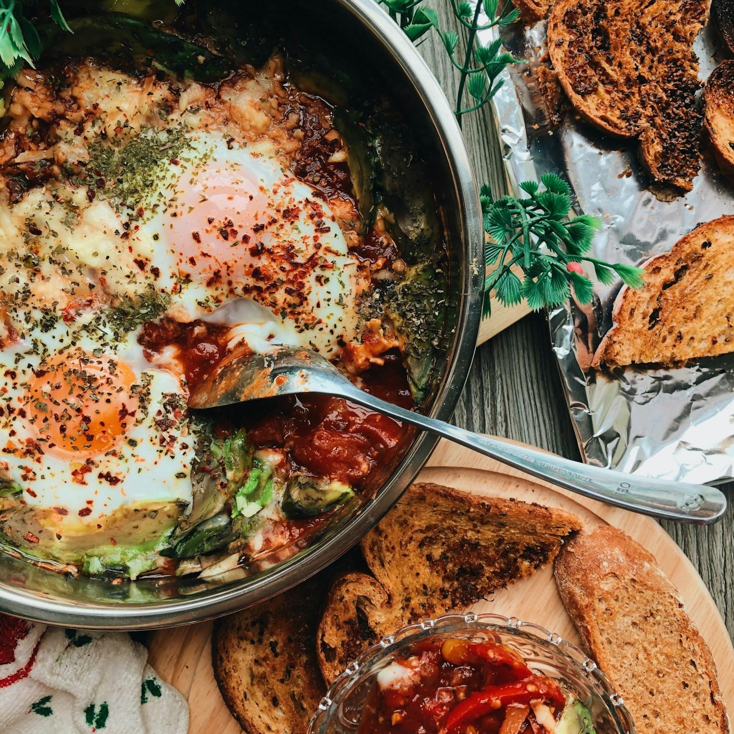 Members collaborating in a modern kitchen, sharing recipes and techniques